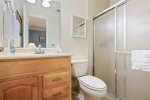 Fourth bedroom ensuite: a vanity cabinet keeps you organized throughout your stay